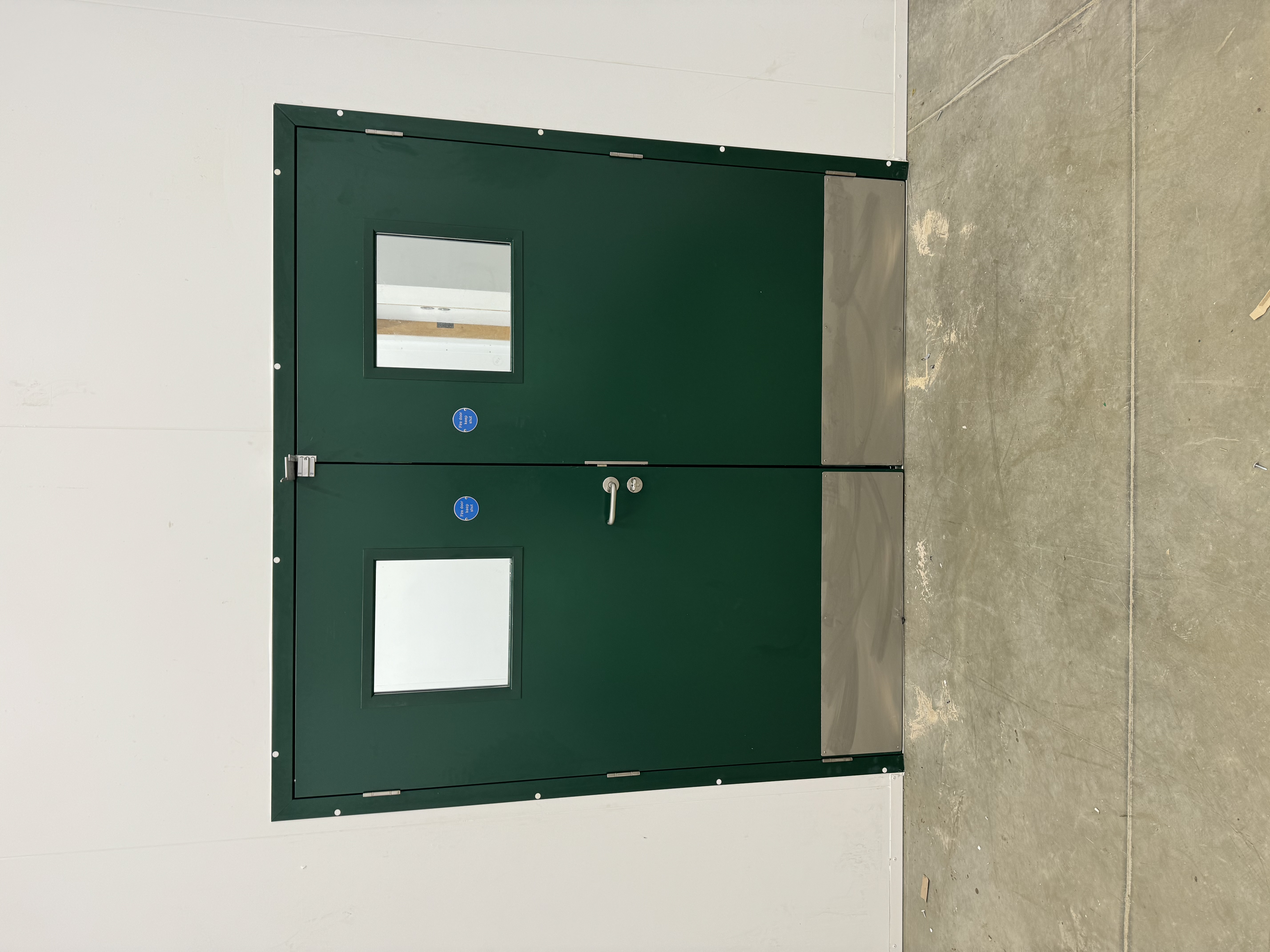 Fire rated hinged door with vision panels